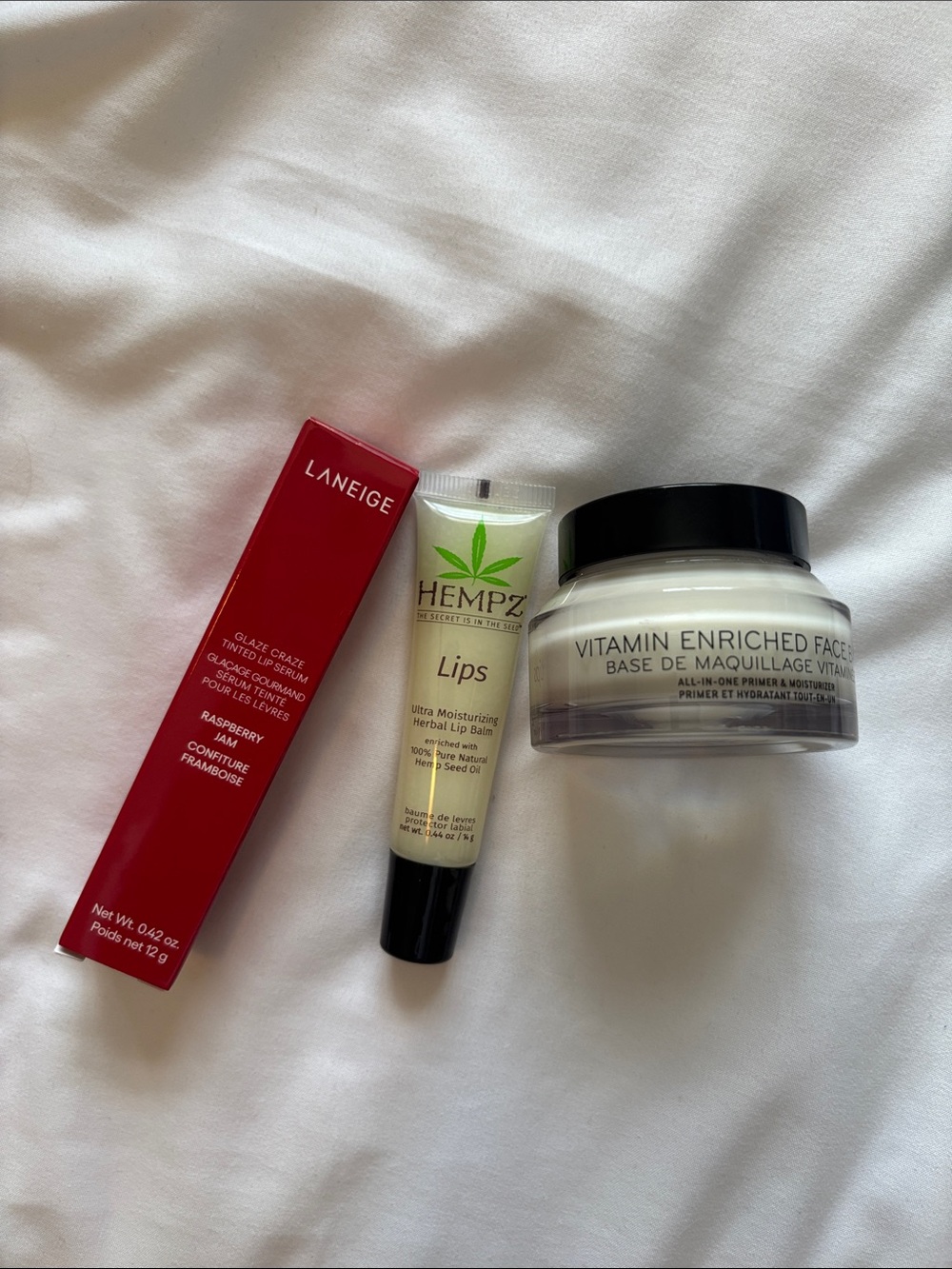 Laneige Raspberry Glaze Lip Serum & Hempz Ultra Moisturizing Lip Balm - Pink